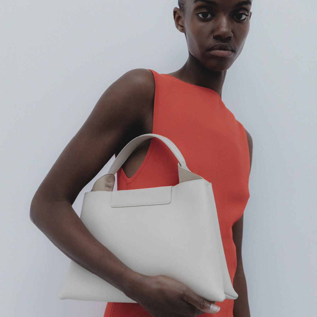 REE PROJECTS Elieze Medium Beige Soft Calf Italian Leather Spacious Button Closure Top Handle Cross Body Strap Casual Elegant Functional Everyday