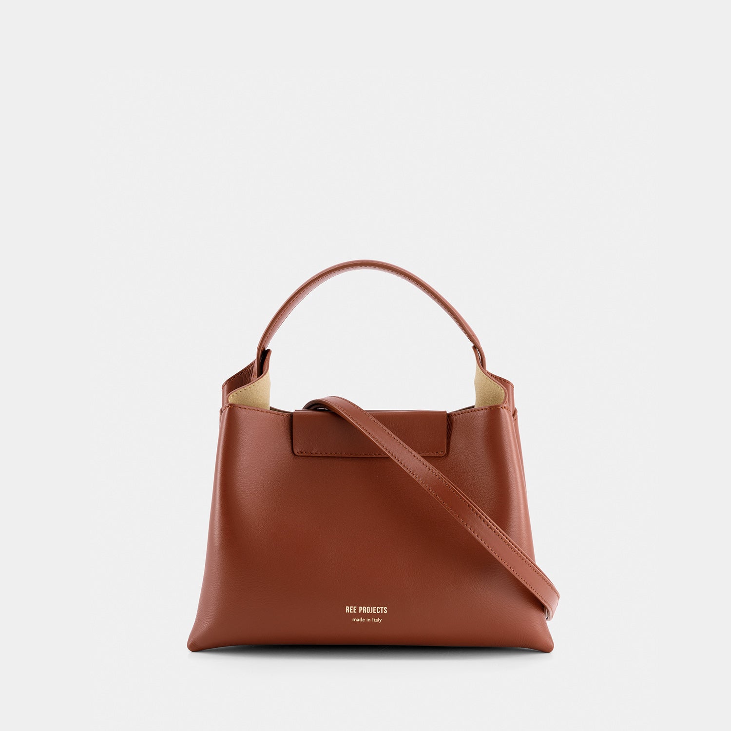 REE PROJECTS Elieze Mini Cognac Brown Soft Italian Leather Button Closure Top Handle Handbag Cross Body Strap Casual Elegant Functional Everyday Evening